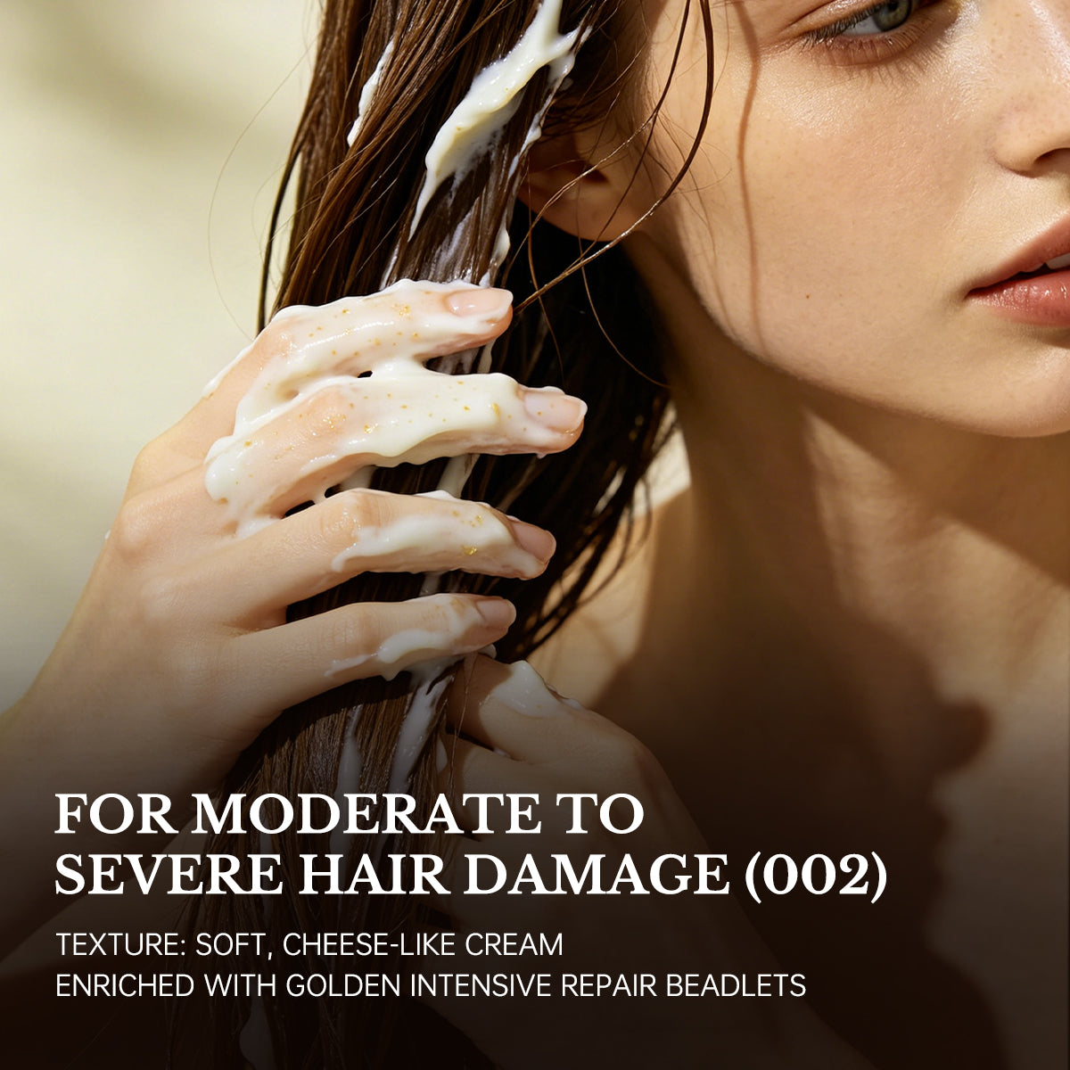 Woman applying intensive strengthening hair mask for moderate to severe hair damage
